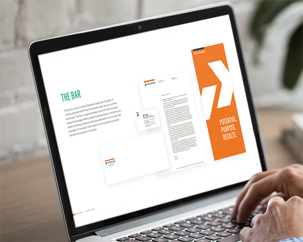 Preview of brand book being viewed on a laptop.