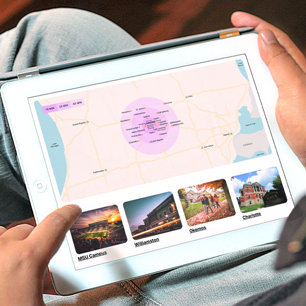 Person viewing a map of places near Lansing on the Lansing 5:01 site