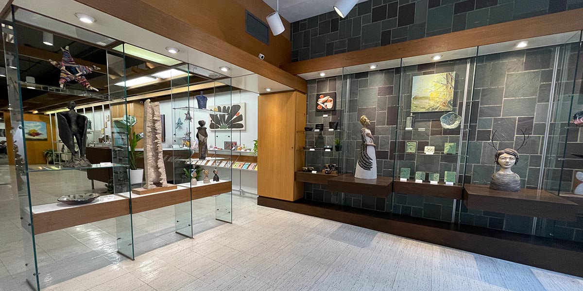 Front of Nelson Gallery showing art on shelves. Redhead offices are above the Nelson Gallery.